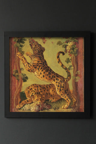Image of the Framed Leopard Love Art Print hanging on the wall
