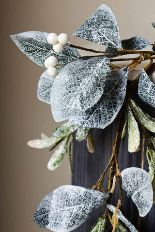 Close-up image of the Frosted Laurel & Mistletoe Christmas Garland