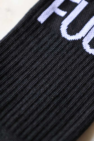Detailed image of the material of the Fuck Off Black Socks. 