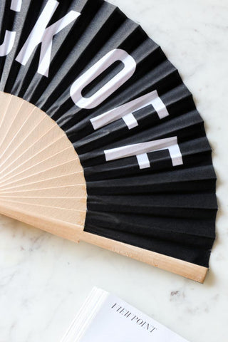 Close-up image of the Fuck Off Wooden Fan.