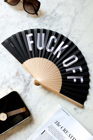 Lifestyle image of the Fuck Off Wooden Fan. 