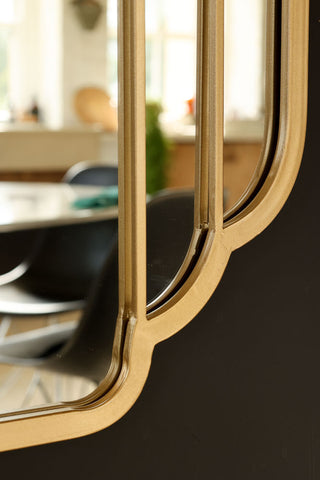 Close-up image of the frame on the Gatsby Inspired Gold Indoor/Outdoor Mirror