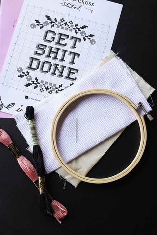 Image of the contents in the Get Shit Done Cross Stitch Kit