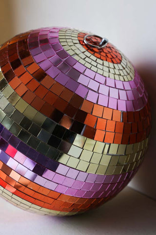 Angled close-up image of the Gold & Pink Stripy Disco Ball