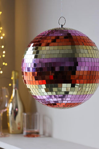 Image of the Gold & Pink Stripy Disco Ball hanging
