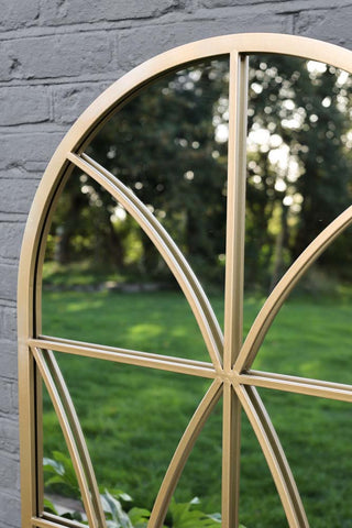 Close-up image of the arched top on the Gold Detailed Window Pane Indoor/Outdoor Mirror