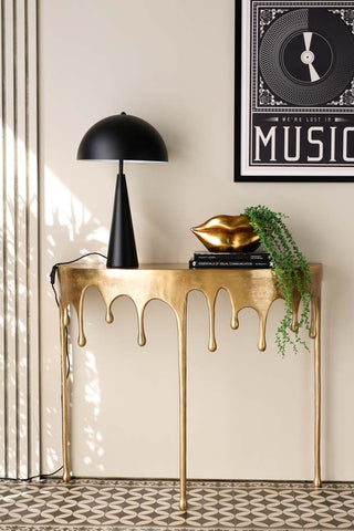 Lifestyle image of the Gold Drip Console Table