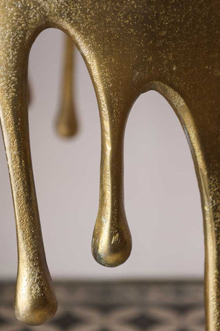 Detail image of the Gold Drip Coffee Table drips