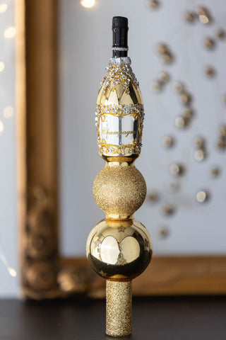 Lifestyle image of the Gold Glitter Champagne Bottle Christmas Tree Topper 