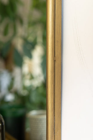 Image of the finish for the Distressed Gold Metal Mirror With Shelf