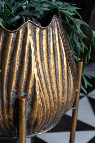 Close-up image of the texture on the Gold Scallop Planter On Stand
