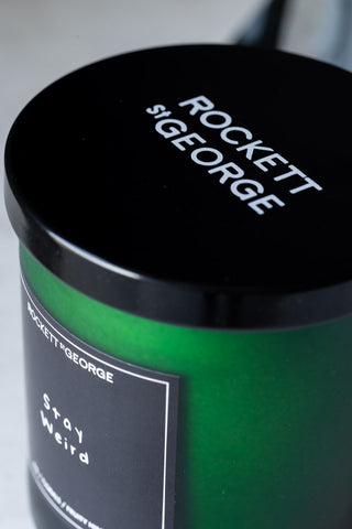 Image of the lid for the Rockett St George Green Stay Weird Scented Candle