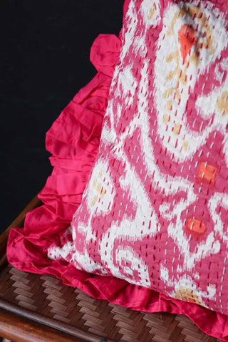 Close-up image of the Fuchsia Ikat & Frill Cotton Cushion