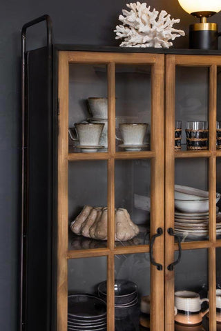 Lifestyle image of the Industrial Style Wooden Display Cabinet On Wheels with the doors closed