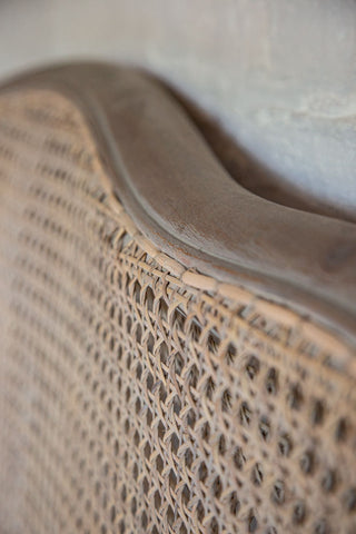 Close-up image of the woven detail on the headboard of the King Size Roll Top Woven Cane Bed
