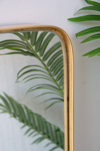 Close-up image of the glass inset on the Large Rectangular Gold Framed Wall Mirror