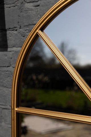 Close-up image of the Tall Gold Arched Garden Mirror