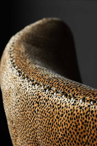 Close-up image of the Leopard Print Button Back Velvet Armchair