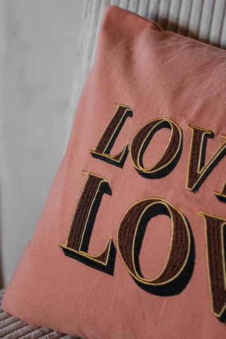 Detail image of the Love Is Love Embroidered Blush Pink Cushion
