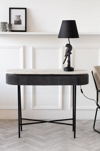 Front on lifestyle image of the Mango Wood & Marble Dark Oval Console Table