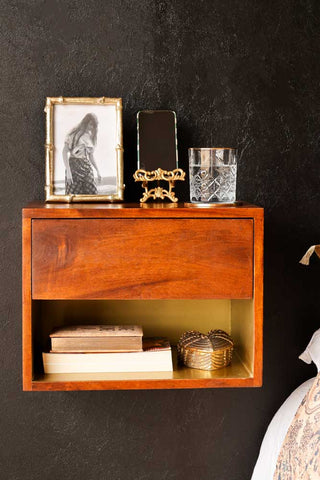 Front on Lifestyle image of the Mango Wood Wall-Hung Bedside Shelf
