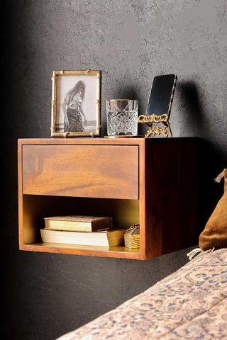 Front-on lifestyle image of the Mango Wood Wall-Hung Bedside Shelf