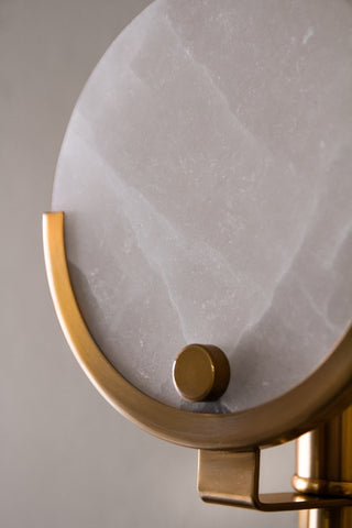 Close-up of the marble disc element of the Marble Disc & Brass Wall Light