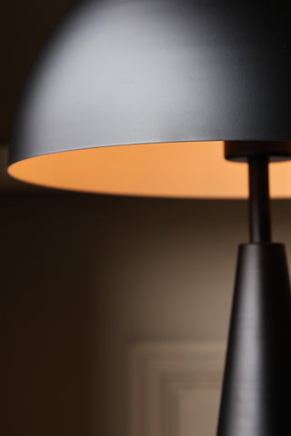 Close-up image of the Sublime Matt Black Table Lamp lit