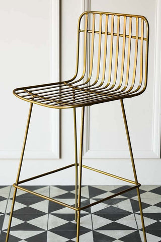 Lifestyle image of the midas bar stool with tiled flooring