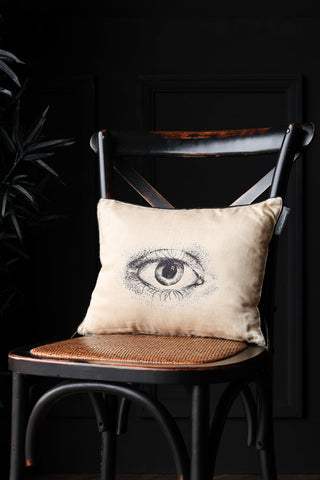 lifestyle image of Mind's Eye Silk Cushion on a black background