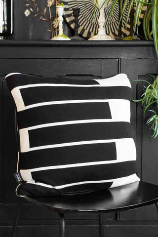 Lifestyle image of the Monochrome Block Knitted Cushion