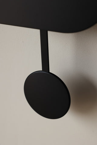 Image of the pendulum on the Modern Black Cuckoo Wall Clock