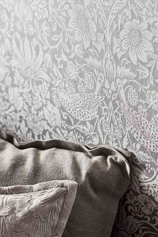 Lifestyle image of the Morris Pure Wallpaper - Pure Strawberry Thief - Silver Stone