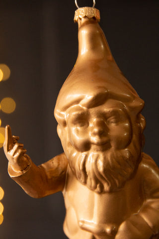 Close-up image of the Naughty Gold Gnome Christmas Tree Decoration
