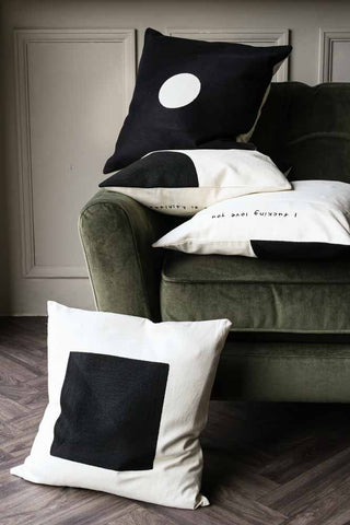 Image of the Monochrome Cushion Collection on a green sofa