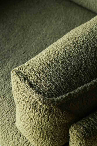 Close-up image of the Olive Chunky Boucle Armchair