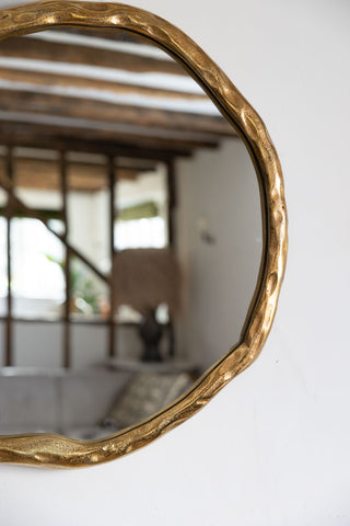 Close-up image of the Organic Round Gold Wall Mirror