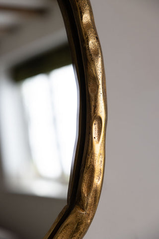 Image of the finish for the Organic Round Gold Wall Mirror