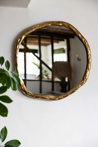 Lifestyle image of the Organic Round Gold Wall Mirror