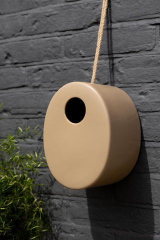 Lifestyle image of the Oval Ceramic Sand Bird House Nesting Box
