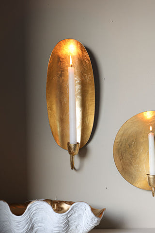 Lifestyle image of the Oval Gold Leaf Candlestick Holder Wall Sconce