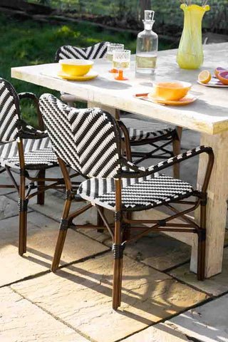 Lifestyle image of the Parisian Bistro Style Outdoor Dining Chair at a table