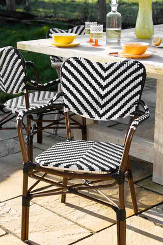 Lifestyle image of the Parisian Bistro Style Outdoor Dining Chair outside