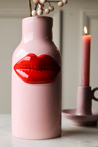 Close-up image of the Pink Ceramic Vase With Luscious Red Lips