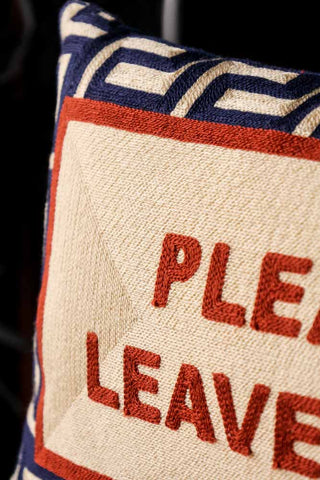 Close-up image of the Please Leave By 9 Cushion
