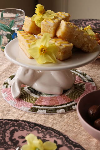 image of one lazy rabbit cupcake plate in the centre of the table with lemon slices stacked on the plate.