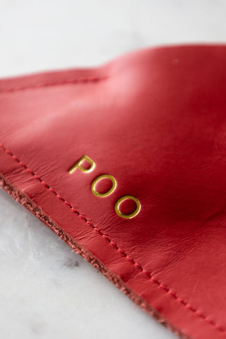 Close-up image of the Red Triangle Dog Poo Bag Pouch