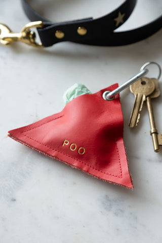 Lifestyle image of the Red Triangle Dog Poo Bag Pouch