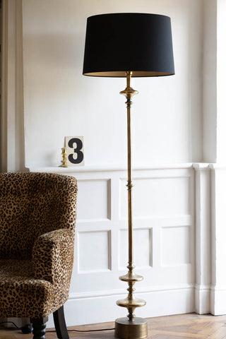 Lifestyle image of the Retro Base Floor Lamp With Black Linen Shade