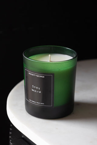 Lifestyle image of the Rockett St George Green Stay Weird Scented Candle with no lid